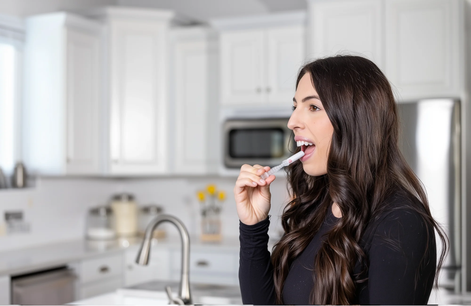 A woman self-administering a saliva test